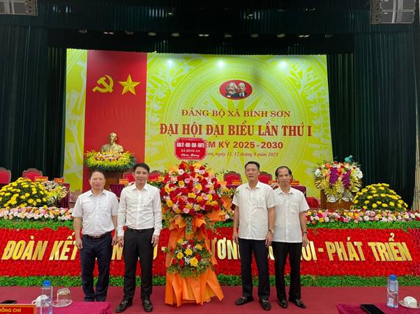 A group of men standing in front of a stage with flowers

AI-generated content may be incorrect.